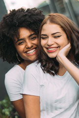 Two women smiling