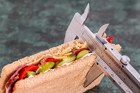 A ruler measuring sandwich portions