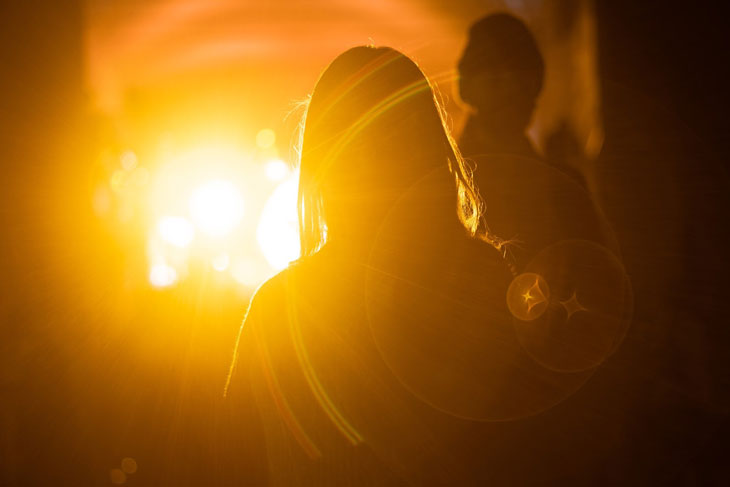 Silhouettes of people staring at the sunset