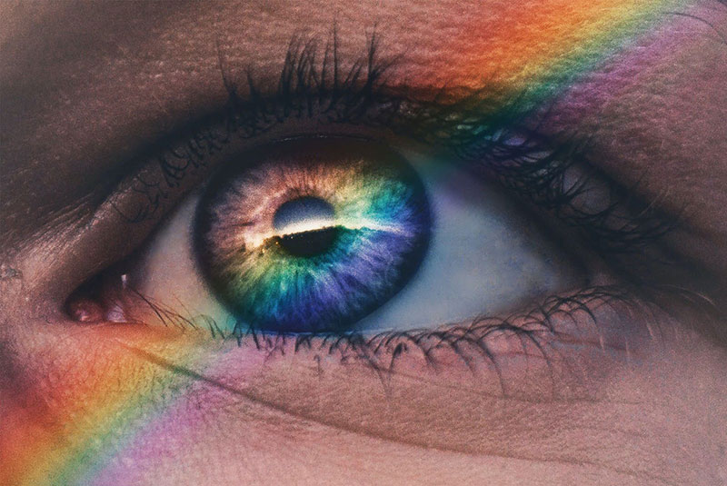 Close up of an eye in an EMDR therapy session with rainbow across it