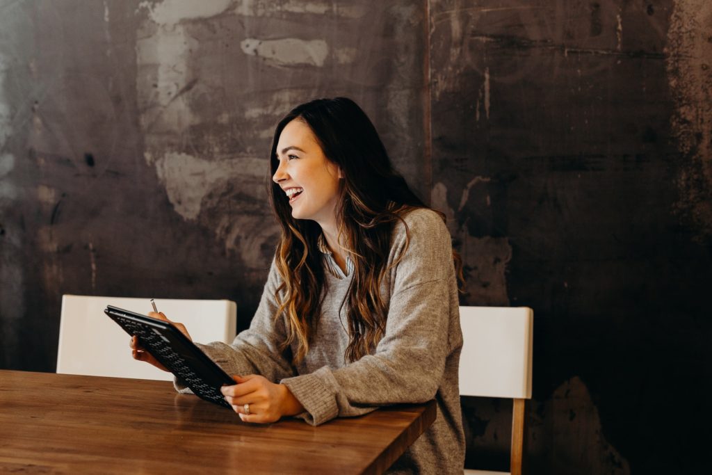 Young woman smiling looking happy at work