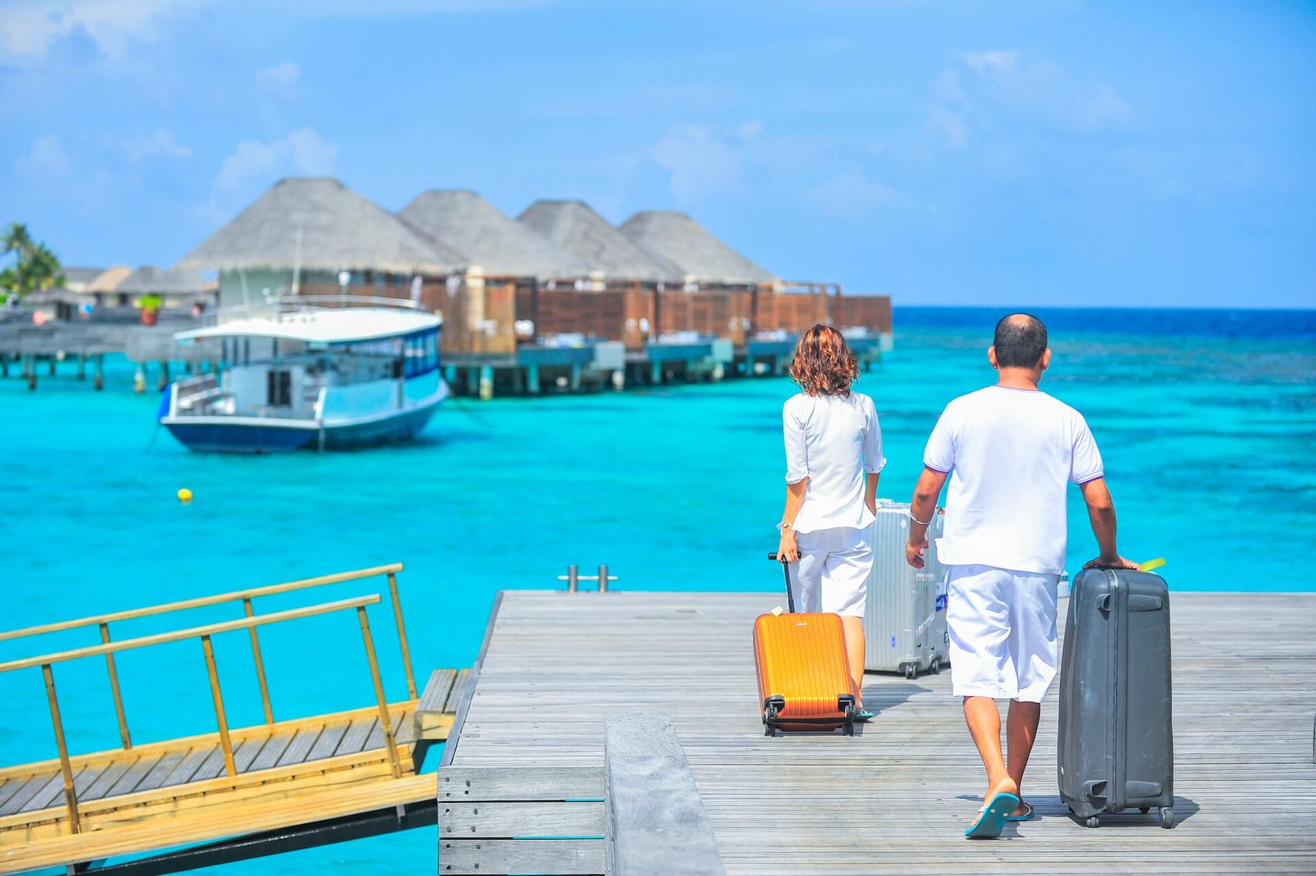 Man and woman docking to vacation villas for a mental health boost