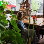 Woman looking thoughtful at a tea shop