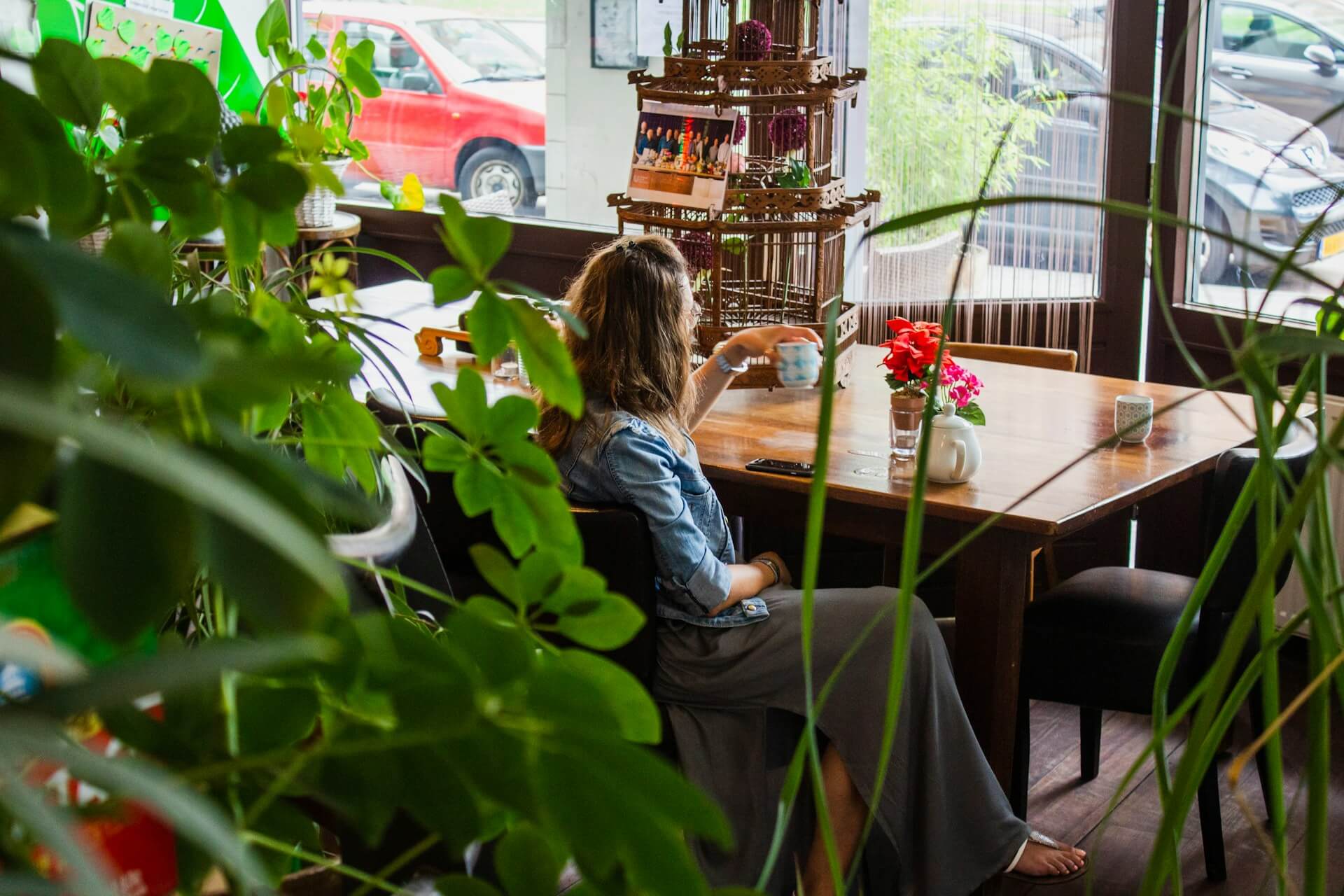 Woman looking thoughtful at a tea shop